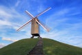 Windmill on green hill in Bruges