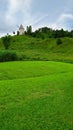 Windmill on a green hilltop