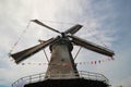 Windmill of Haastrecht along Hollandse IJssell with flags national Windmill day in the Netherlands Royalty Free Stock Photo