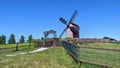 Windmill in the Hill In Landscape Nice Arc Entrance Fence and Clear Blue Sky