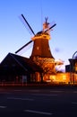 Windmill illuminated at night Royalty Free Stock Photo