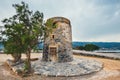 Windmill on Kalydon Peninsula near Agios Nikolaos, Crete, Greece Royalty Free Stock Photo