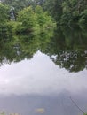 Windmill, lake, trees , rain, reflections,