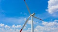 Windmill, large wind power turbines spinning to generating clean renewable energy for sustainable development Royalty Free Stock Photo