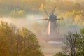 Windmill in the morning in fog Royalty Free Stock Photo