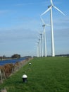 Windmill in line for green energie Royalty Free Stock Photo