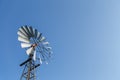 Windmill nestled in a blue sky