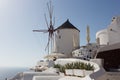 Windmill of Oia town at sunny day, Santorini Royalty Free Stock Photo