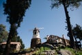 Windmill with old rock castle. red tile roof and string lights. Modern windmill. Country side on a bright summer day