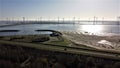 Windmill park in the Grevelingen, a nature reserve in the Netherlands with Dutch beauty with a road crossing the land.