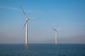 Windmill park westermeerdijk Netherlands, wind mill turbine with blue sky in ocean, green energy Royalty Free Stock Photo