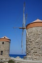 Windmill pier at the commercial harbor in Rhodes city. Rhodes, Greece