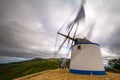 Windmill in Portuguese Mountain. Moinho de vento em paisagem Portuguesa. Royalty Free Stock Photo