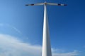 Windmill power generator under blue sky