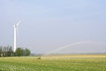Modern wind turbine provides alternative energy for irrigation, Netherlands Royalty Free Stock Photo