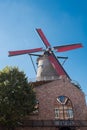 Windmill with red wings in Sluis, Holland Royalty Free Stock Photo