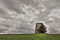 Windmill in ruins in front of a dramatic sky Royalty Free Stock Photo