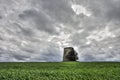 Windmill in ruins in front of a dramatic sky Royalty Free Stock Photo