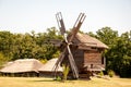 Windmill in a rural area. Wind Farm. Dutch windmill. Landscape with traditional Ukrainian windmills houses in countryside village Royalty Free Stock Photo