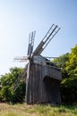 Windmill in a rural area. Wind Farm. Dutch windmill. Landscape with traditional Ukrainian windmills houses in countryside village Royalty Free Stock Photo