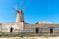 Windmill at the salt flats of Trapani, Sicily, Italy Royalty Free Stock Photo