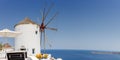 Windmill on Santorini island holidays in Greece travel traveling Oia town Mediterranean Sea Santorin panorama Royalty Free Stock Photo