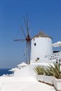 Windmill on Santorini island holidays in Greece travel traveling Oia town Mediterranean Sea Santorin portrait format Royalty Free Stock Photo