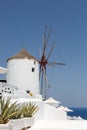 Windmill on Santorini island holidays in Greece travel traveling Oia town Mediterranean Sea Santorin portrait format Royalty Free Stock Photo