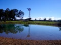 Windmill, shed and pond