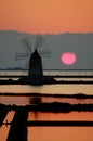 Windmill in a Sicilian saline (Marsala) Royalty Free Stock Photo