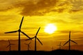 Windmill silhouettes at sunset