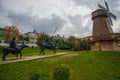 Windmill with sky as background. Sculpture of don Quixote and Sancho Panza. Selale Park, Eskisehir, Turkey