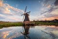 Windmill and sky  reflected in water Royalty Free Stock Photo