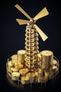 Windmill on Stacks of golden coins. Return on investment on renewable clean energy.