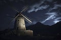 A windmill stands prominently against a dramatic night sky, illuminated by the moon, with mountains in the background, ai