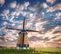 Windmill at sunrise in Netherlands. Beautiful old dutch windmill Royalty Free Stock Photo