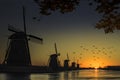 Windmill sunrise silhouette Royalty Free Stock Photo