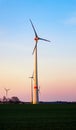 Windmill at Sunset . Wind turbines farm . Royalty Free Stock Photo