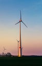 Windmill at Sunset . Wind turbines farm .