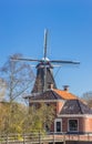 Windmill and traditional house in Eenrum Royalty Free Stock Photo