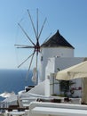 Windmill in a traditional white village to Santorini in Greece.