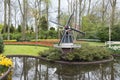 Windmill and tulips in dutch Keukenhof