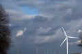 Windmill turbine creating wind green energy Royalty Free Stock Photo