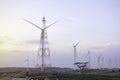 Windmill turbine farm for electricity generation on landscape mountain at sunset sky