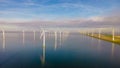 Windmill turbines at sea seen from a drone aerial view from above at a huge windmill park Royalty Free Stock Photo