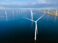 Windmill turbines at sea seen from a drone aerial view from above at a huge windmill park Royalty Free Stock Photo