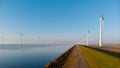 Windmill turbines at sea seen from a drone aerial view from above at a huge winmill park Royalty Free Stock Photo