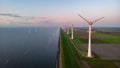 Windmill turbines at sea seen from a drone aerial view from above at a huge winmill park Royalty Free Stock Photo