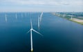 Windmill turbines at sea seen from a drone aerial view from above at a huge winmill park Royalty Free Stock Photo