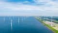 Windmill turbines at sea seen from a drone aerial view from above at a huge winmill park Royalty Free Stock Photo